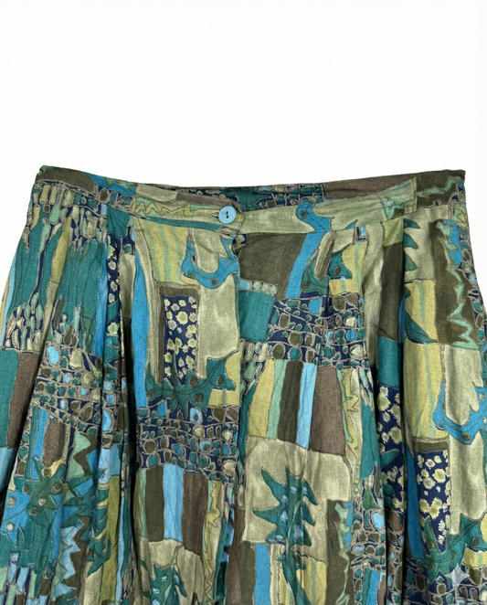 Patterned skirt with a mix of green, blue, and brown colors on a white background