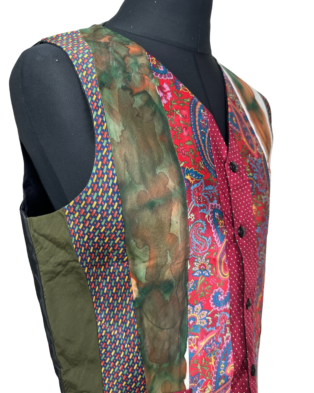 Colorful patterned vest on a mannequin with a white background