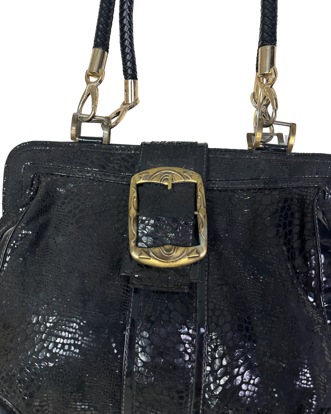 Black textured handbag with gold buckle and strap on a white background