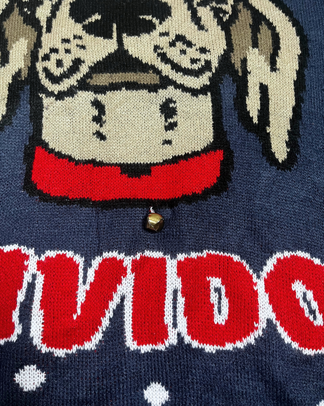 Feliz Navidog Christmas Sweater with a Jingle Bell