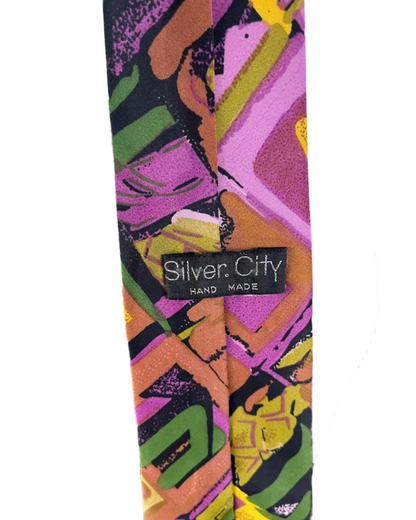 Colorful tie with abstract patterns on a mannequin against a white background, featuring 'Silver City' branding.