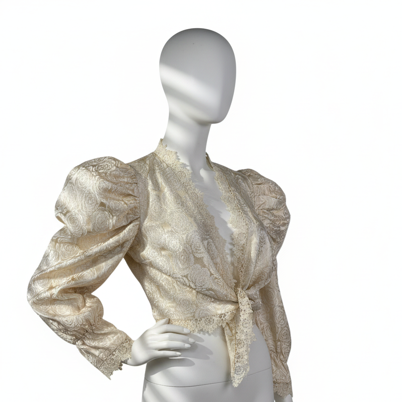 Mannequin wearing a gold and white patterned blouse on a white background
